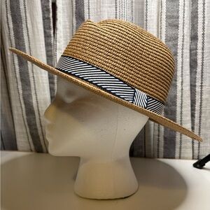 Tan sun hat with navy & white band.